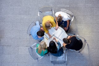 top view,  group of students together  at school table working homework and have fun.jpeg